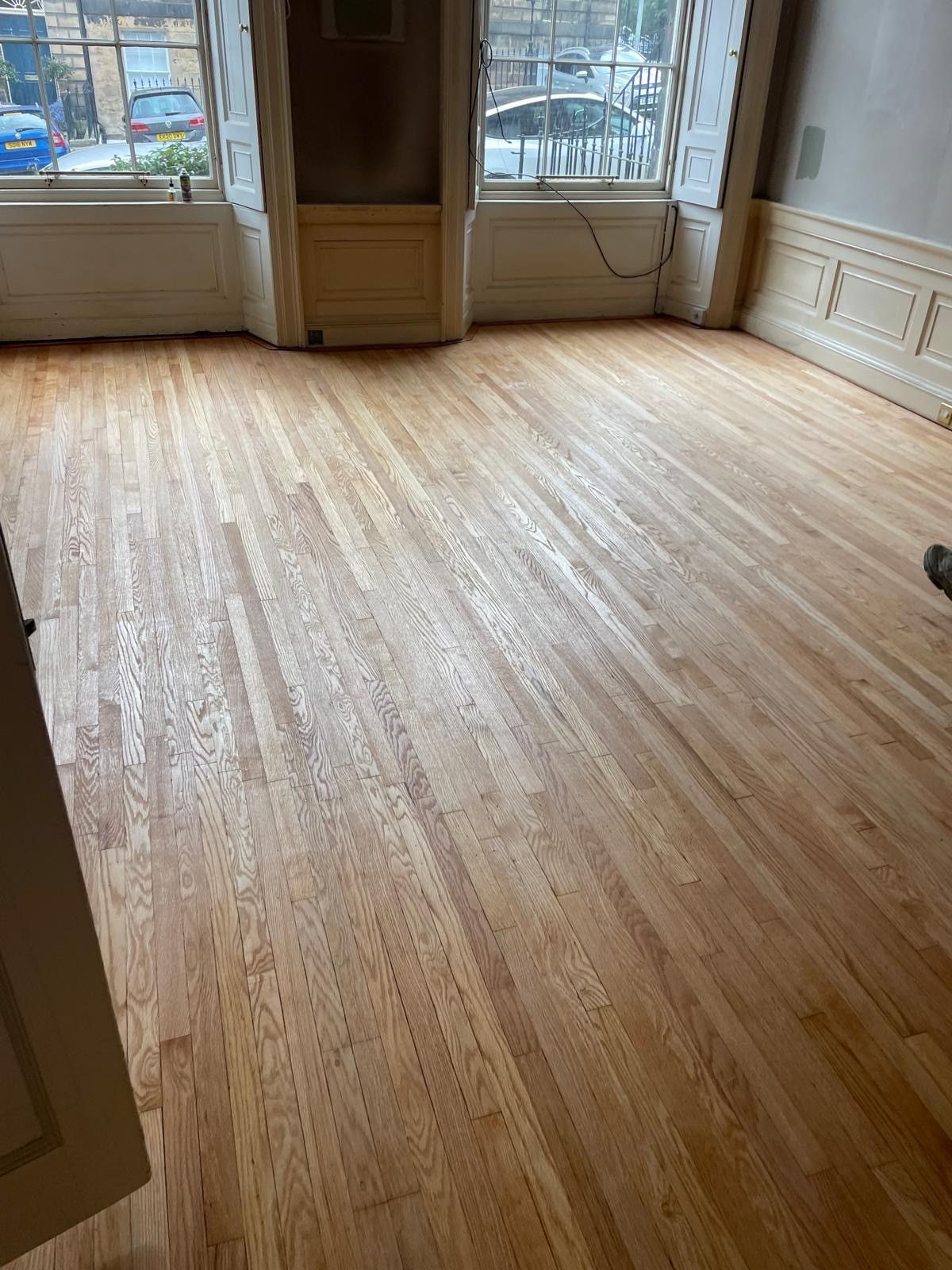 Photo of flooring in a living space which has been restored by sanding and oiling, performed by SR Flooring in Edinburgh