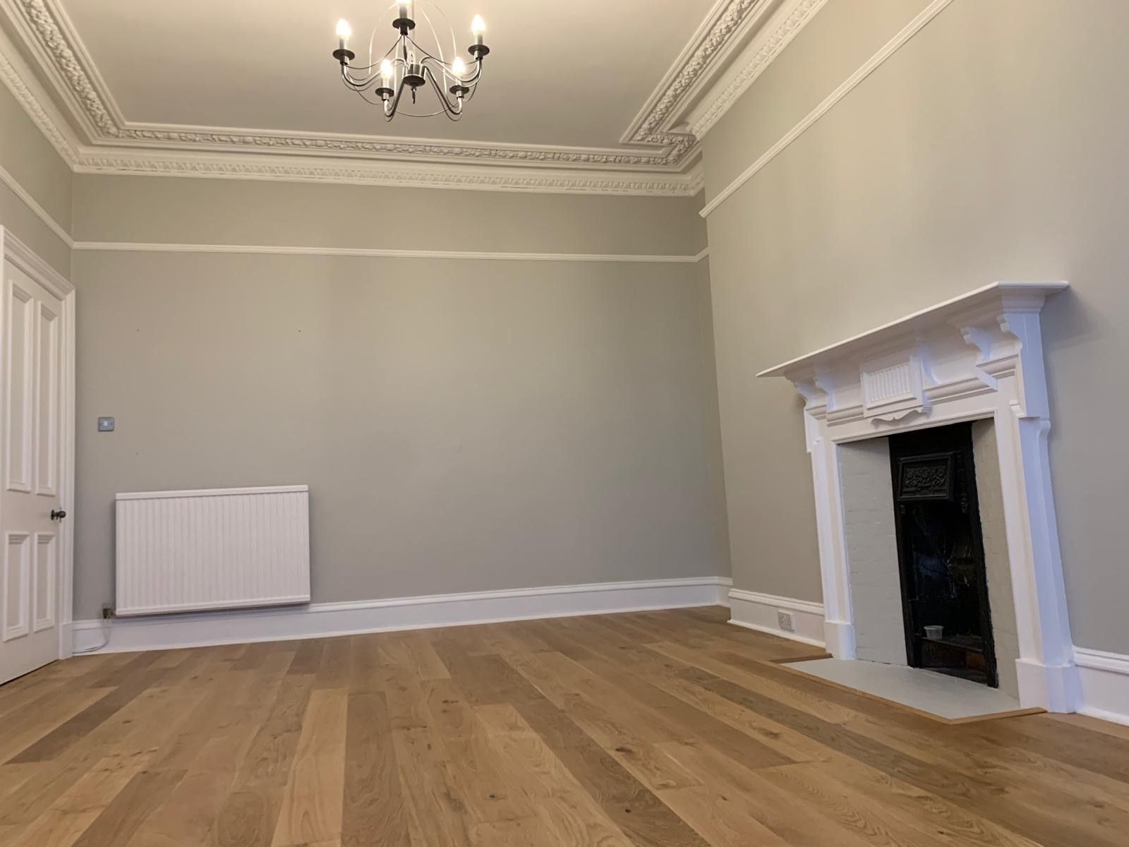 Photo of newly laid hardwood flooring in a domestic home, performed by SR Flooring in Edinburgh