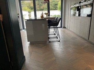 Photo of flooring in a kitchen which has been restored by sanding and oiling, performed by SR Flooring in Edinburgh