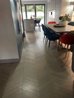 Photo of newly laid hardwood flooring in a kitchen, performed by SR Flooring in Edinburgh